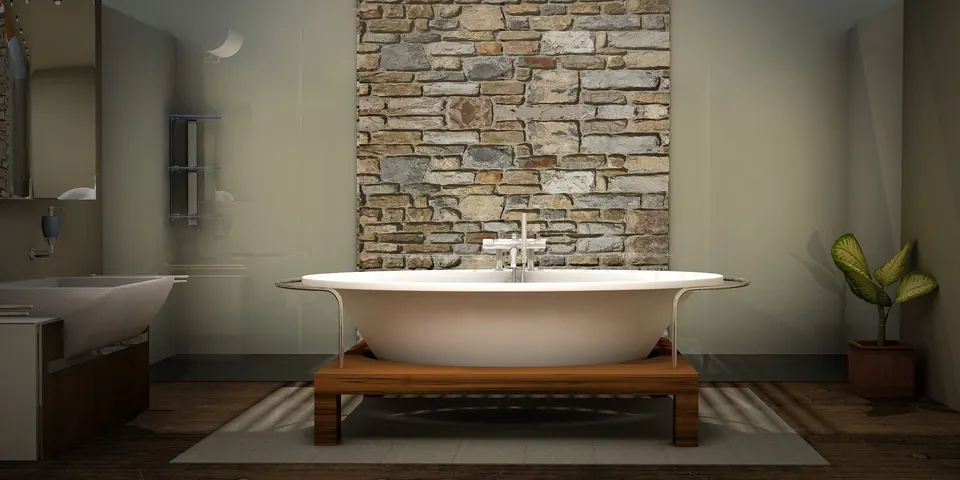 Bad mit Natursteinwand und freistehender Wanne